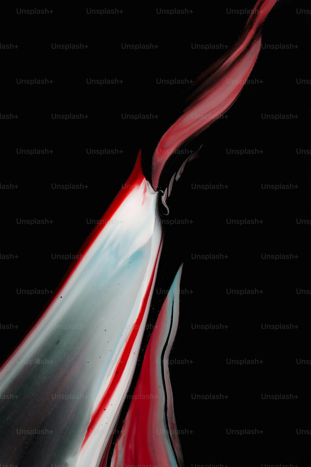 a black and red abstract painting on a black background