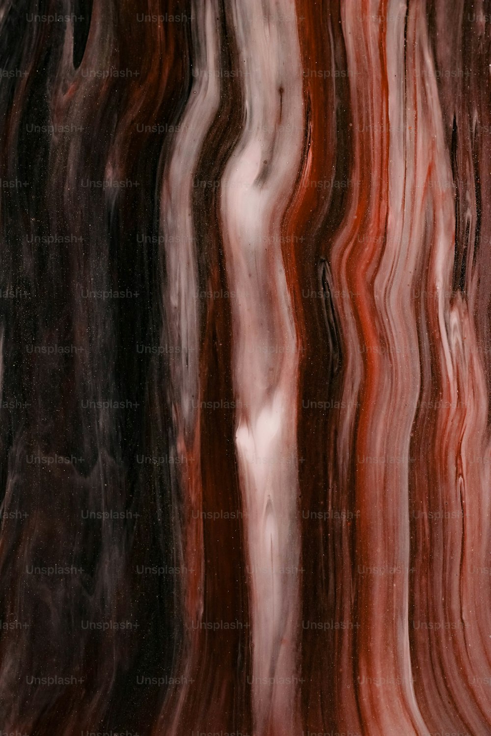 a red, black, and white marble texture