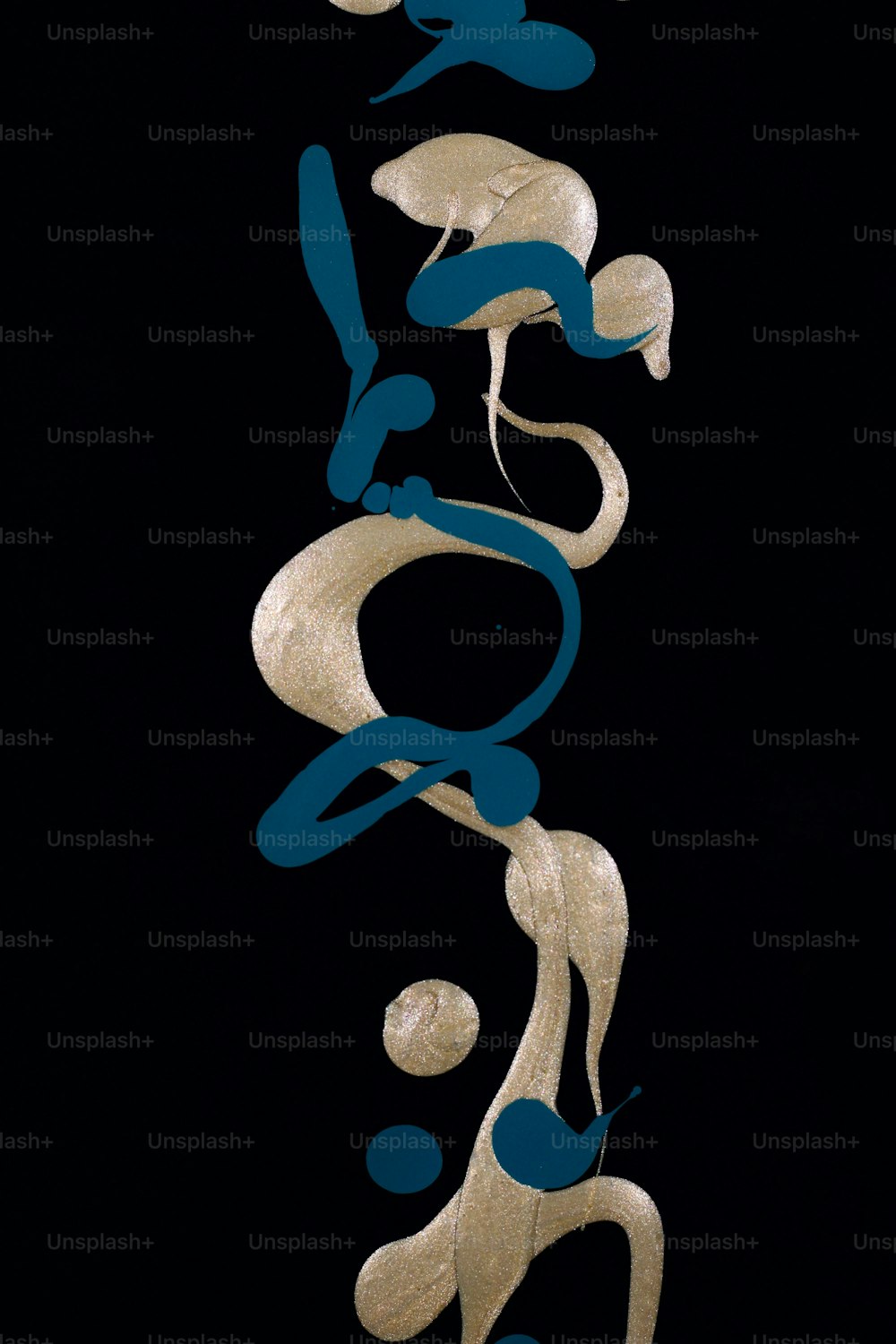 a black background with gold and blue shapes