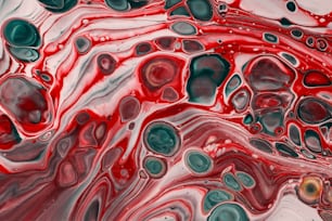 a close up of a red and black liquid