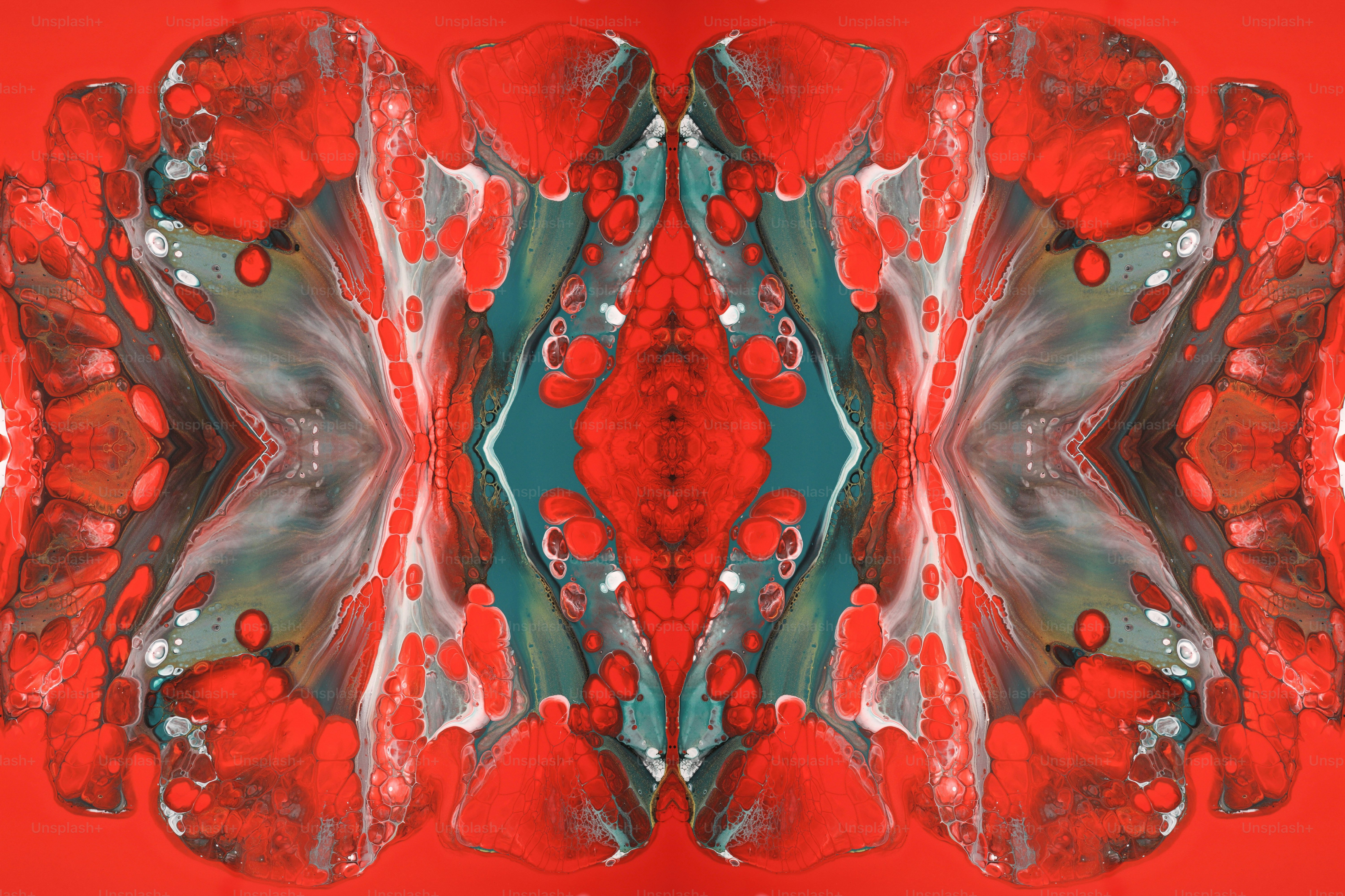 uma imagem abstrata de formas vermelhas e verdes