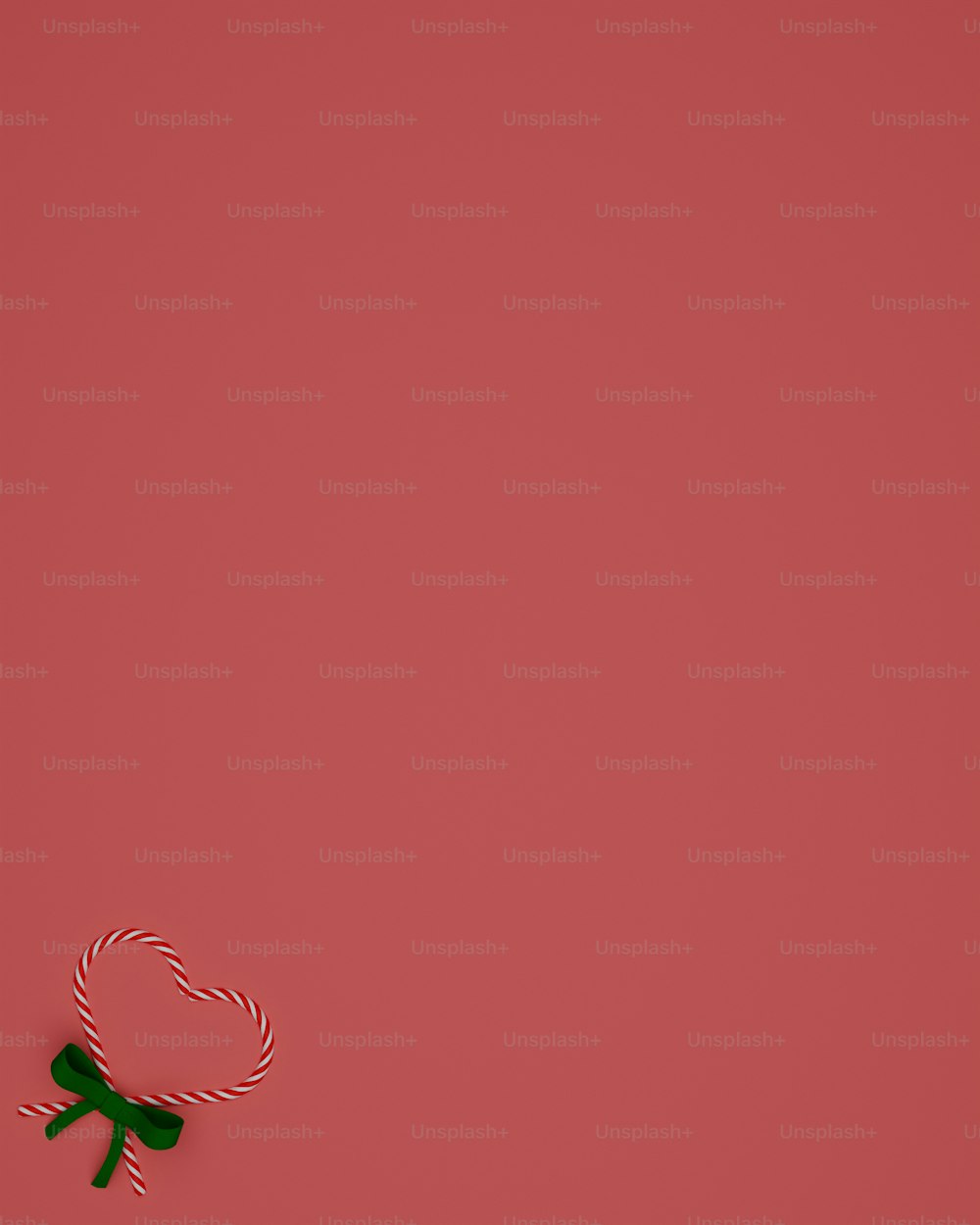 a red wall with a green object on top of it