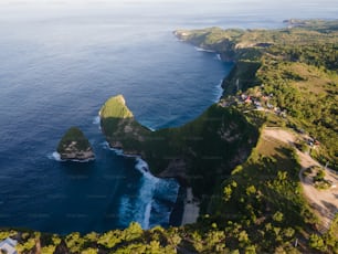 an aerial view of the ocean and a small island