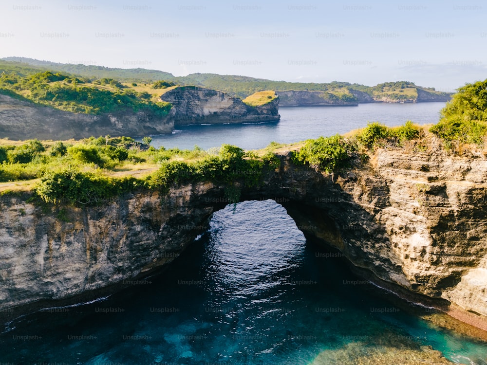 a large body of water with a bridge over it