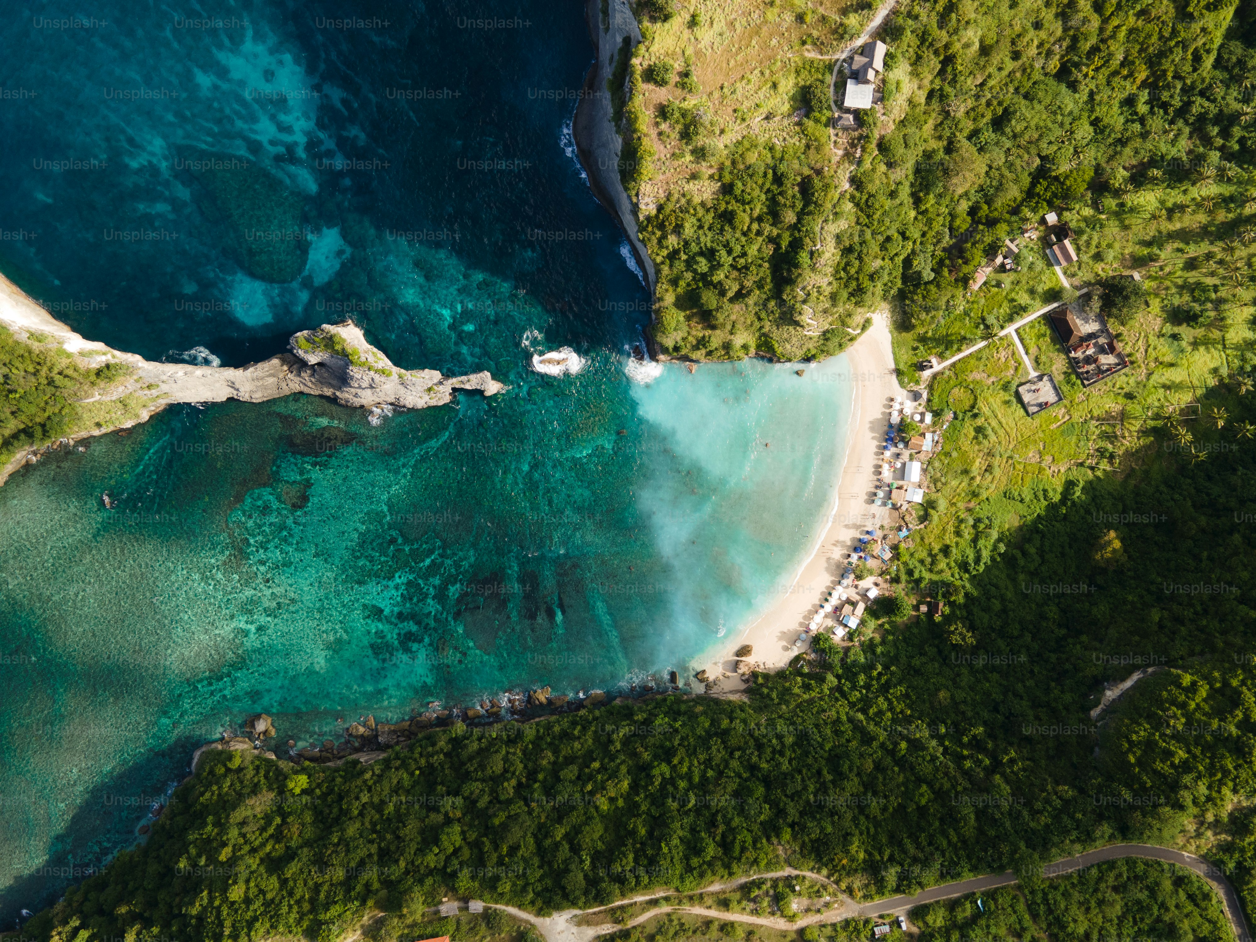 an aerial view of a beach and a body of water