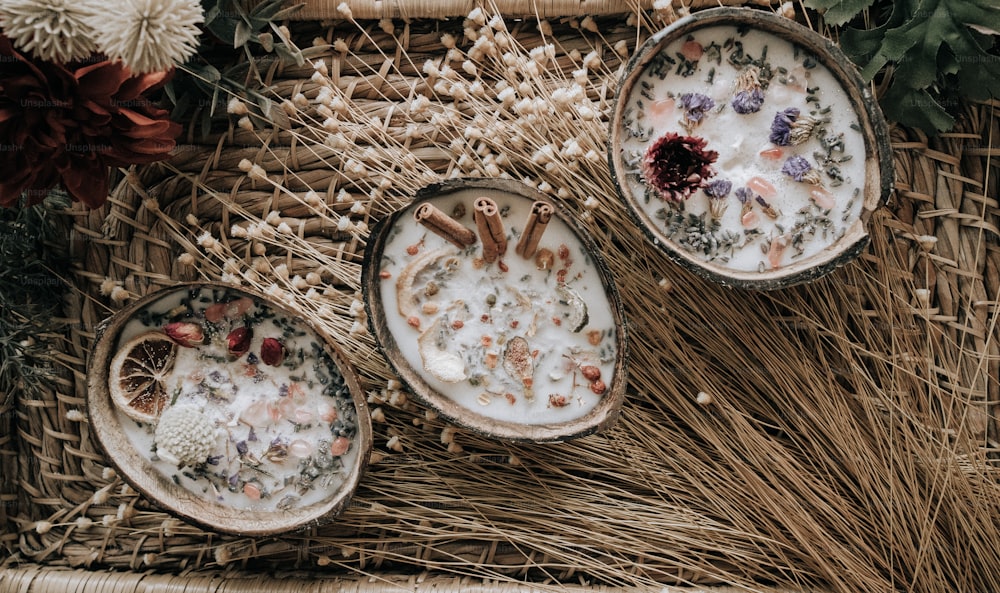 three dishes of food sitting on top of a wicker basket