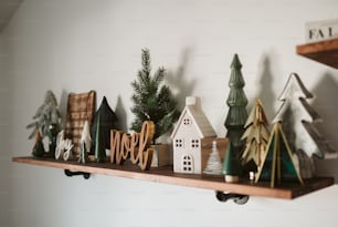 a shelf filled with christmas decorations on top of a wall