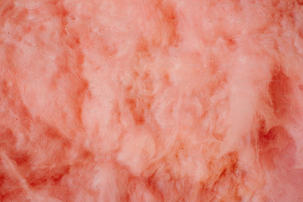 a close up of a pink and orange colored substance
