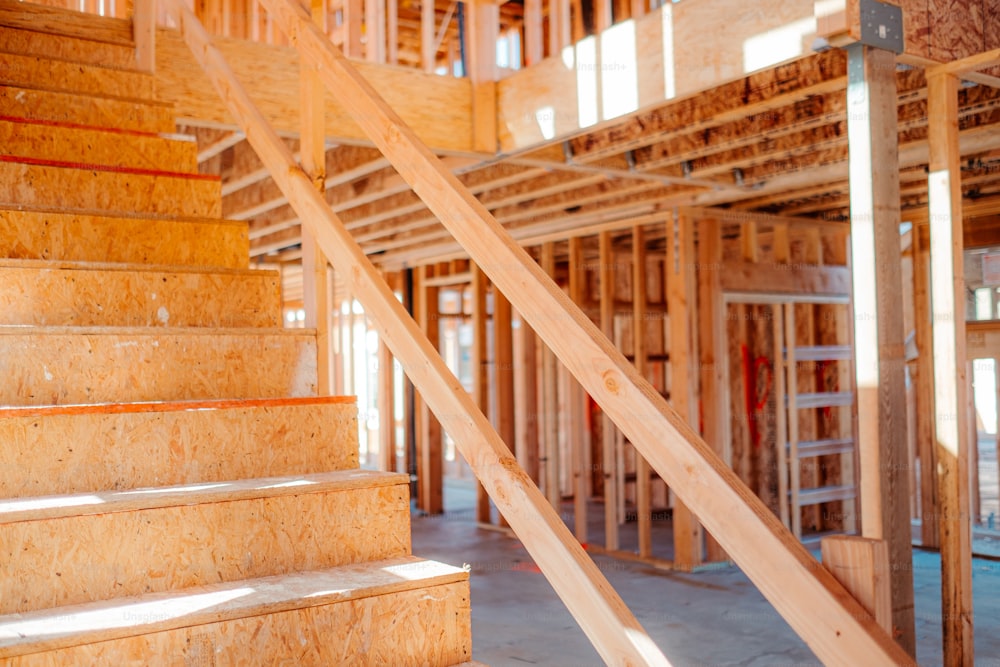 a house under construction with wooden stairs