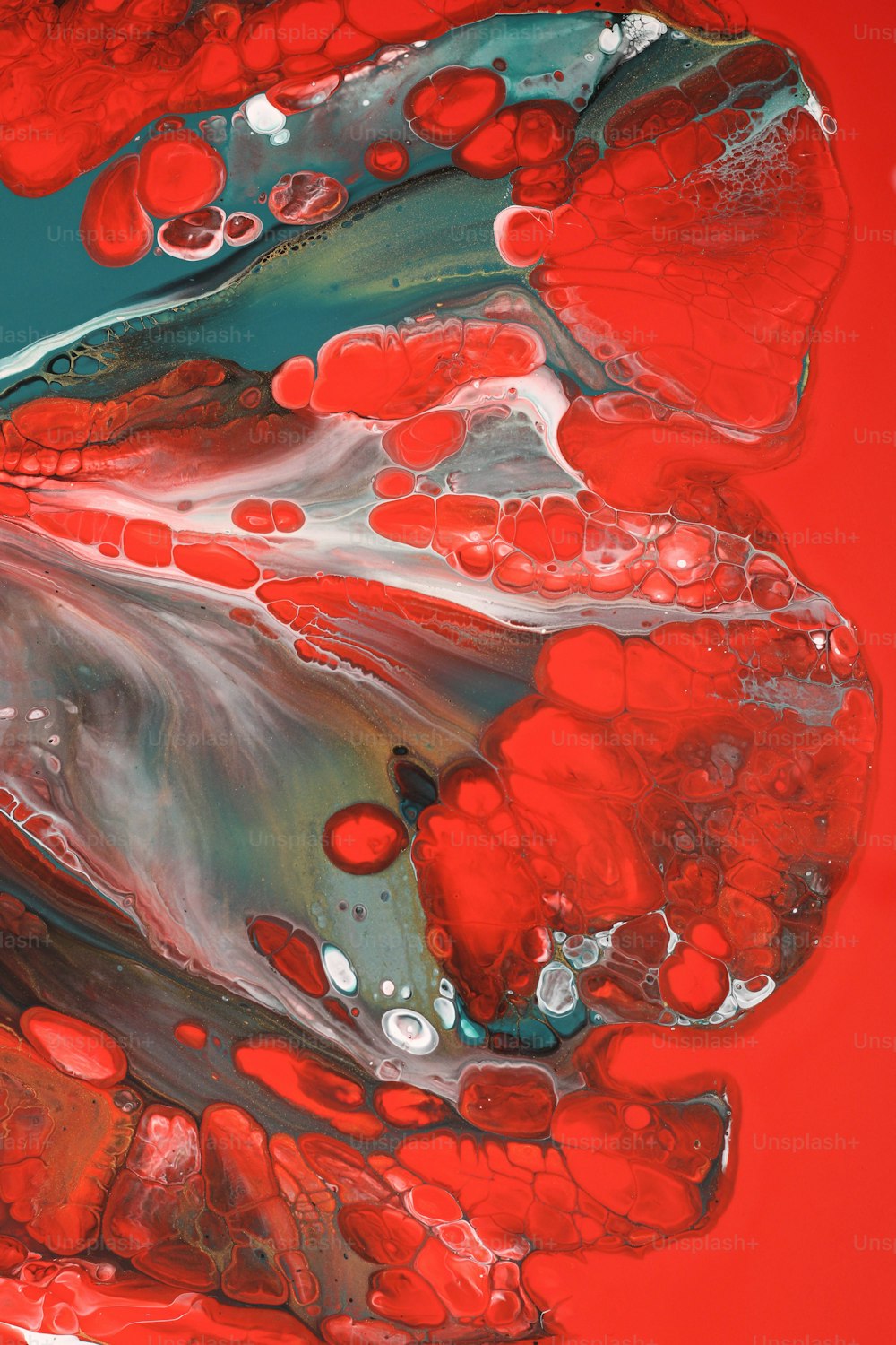an abstract painting with red and blue colors