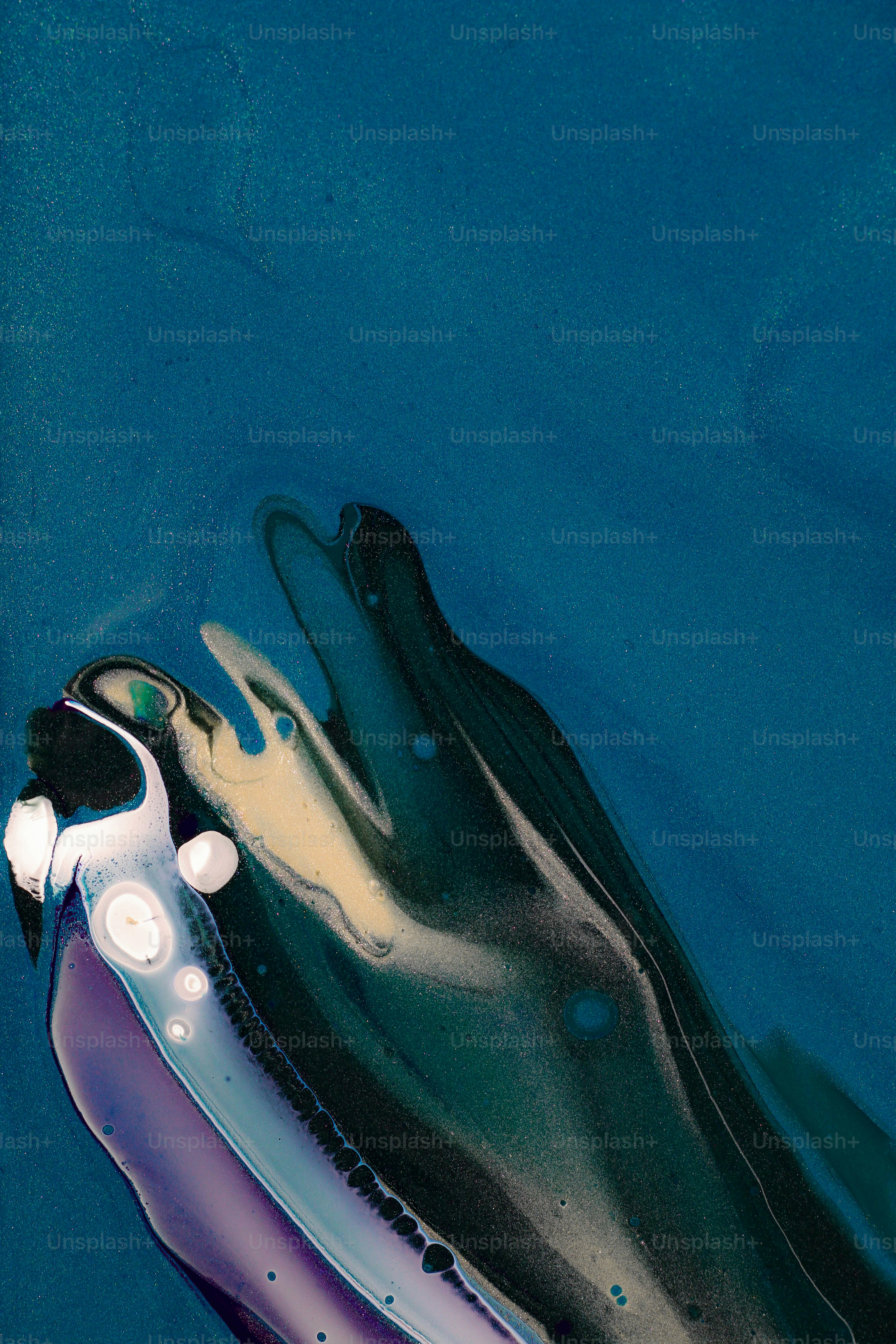 A close up of a pair of shoes in water photo Abstract Image on Unsplash