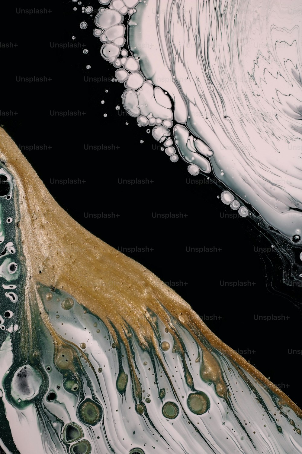 a close up of a black and white background with bubbles
