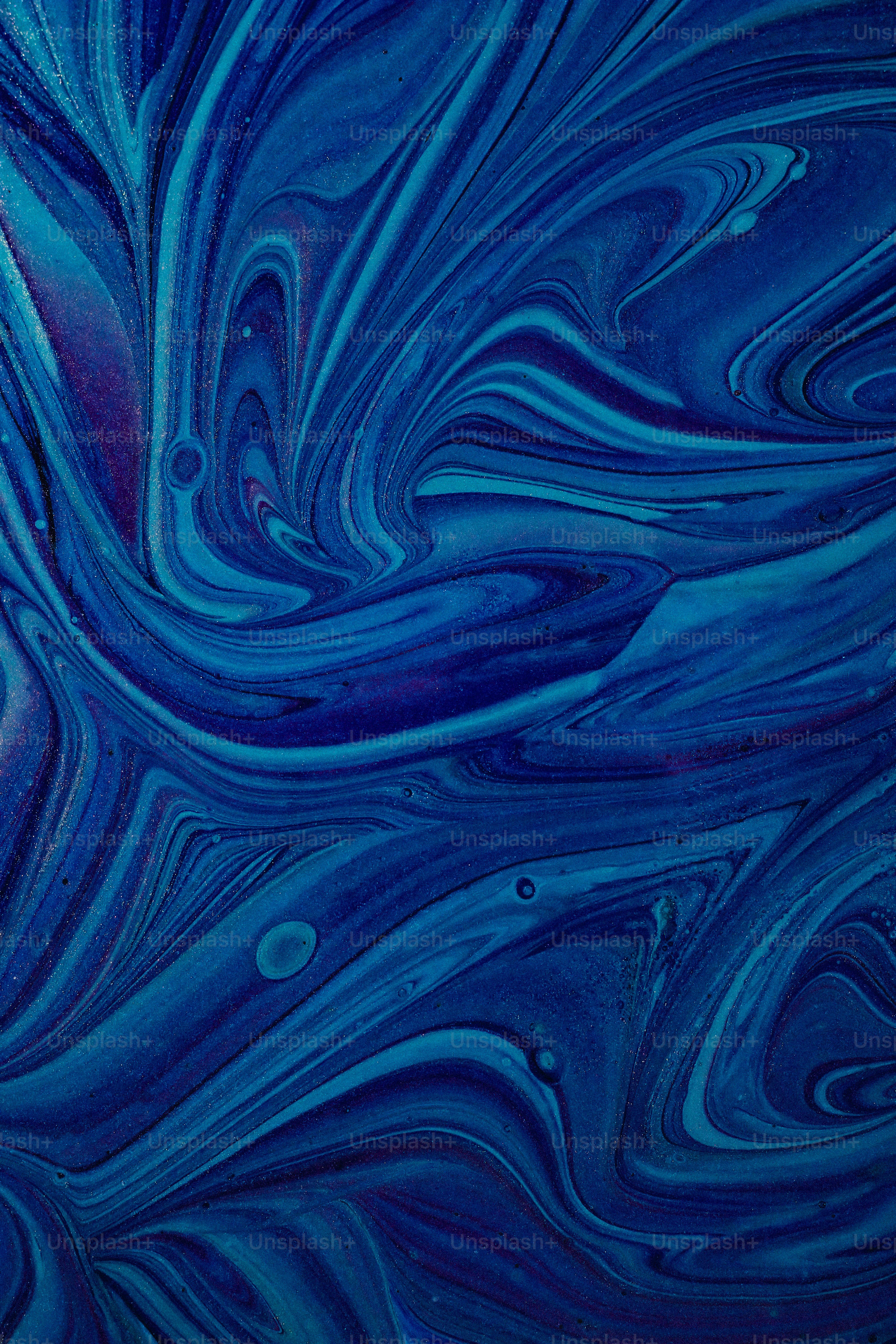 a blue background with swirls and bubbles