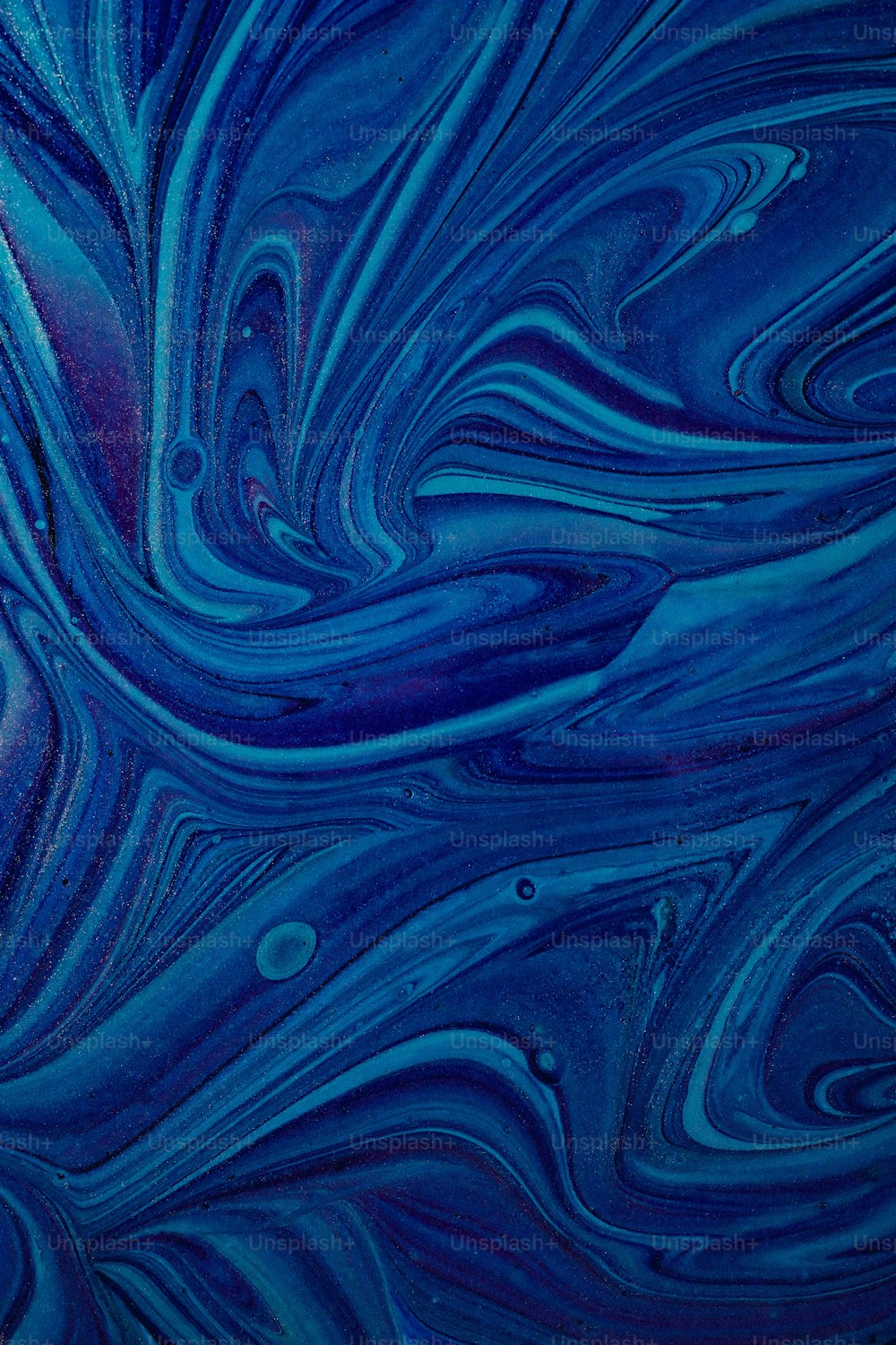 a blue background with swirls and bubbles