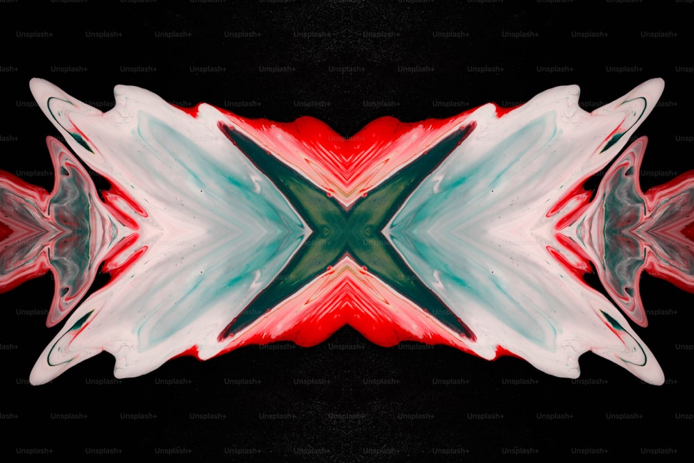 a red, white, and green abstract design on a black background