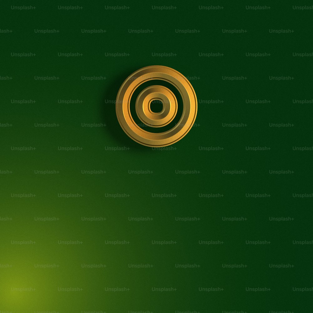 a green wall with a gold button on it