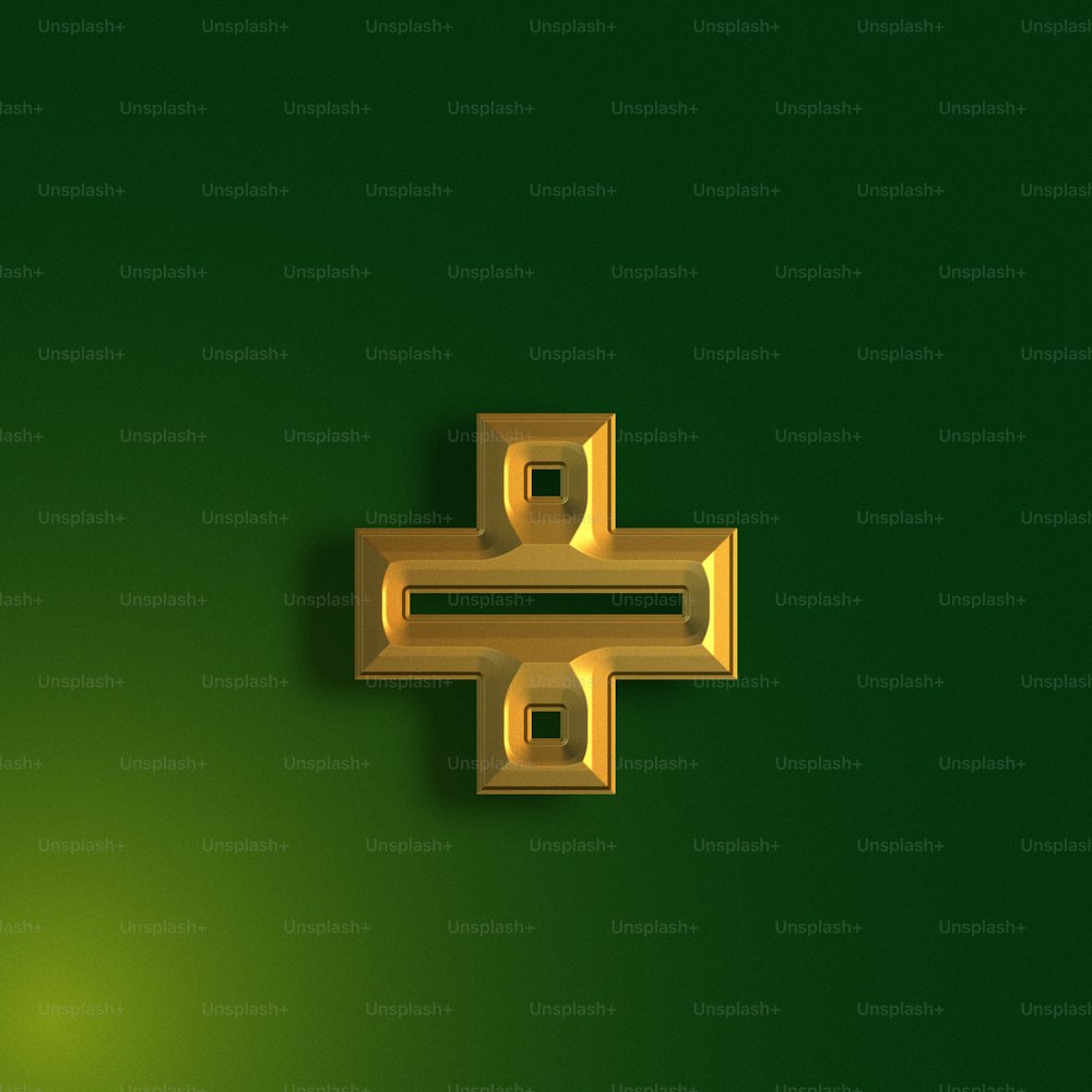 a gold object on a green background