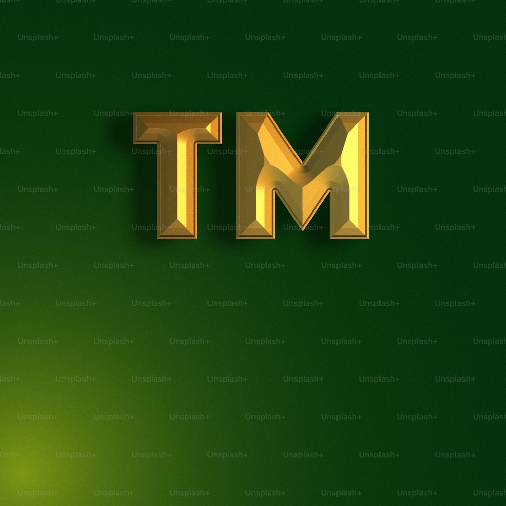 a gold letter m t on a green background