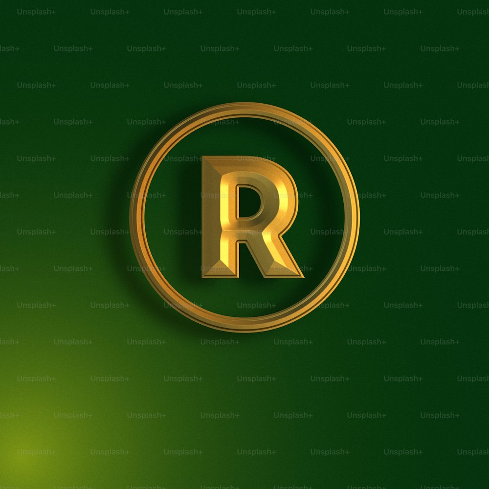 the letter r is inscribed in gold on a green background