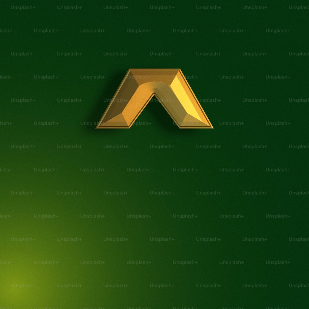 a gold letter on a green background