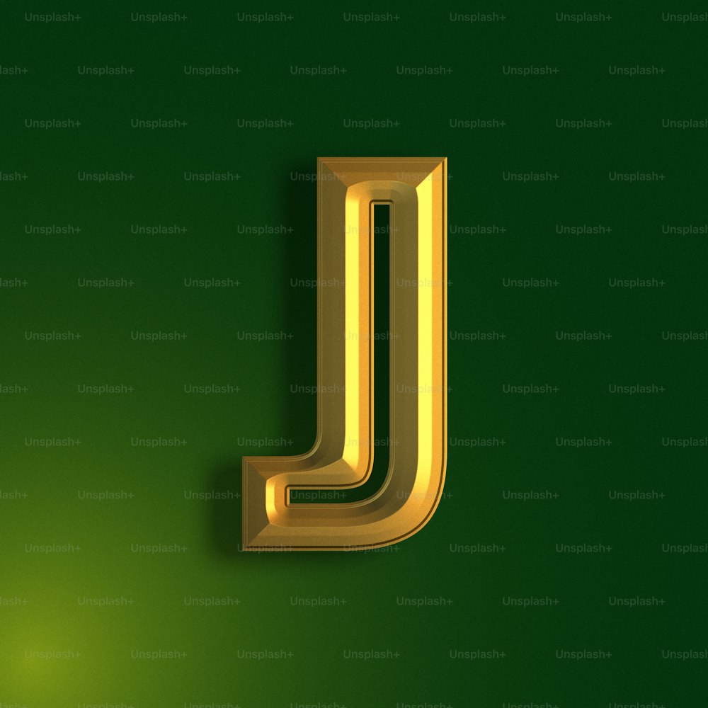 a gold letter j on a green background