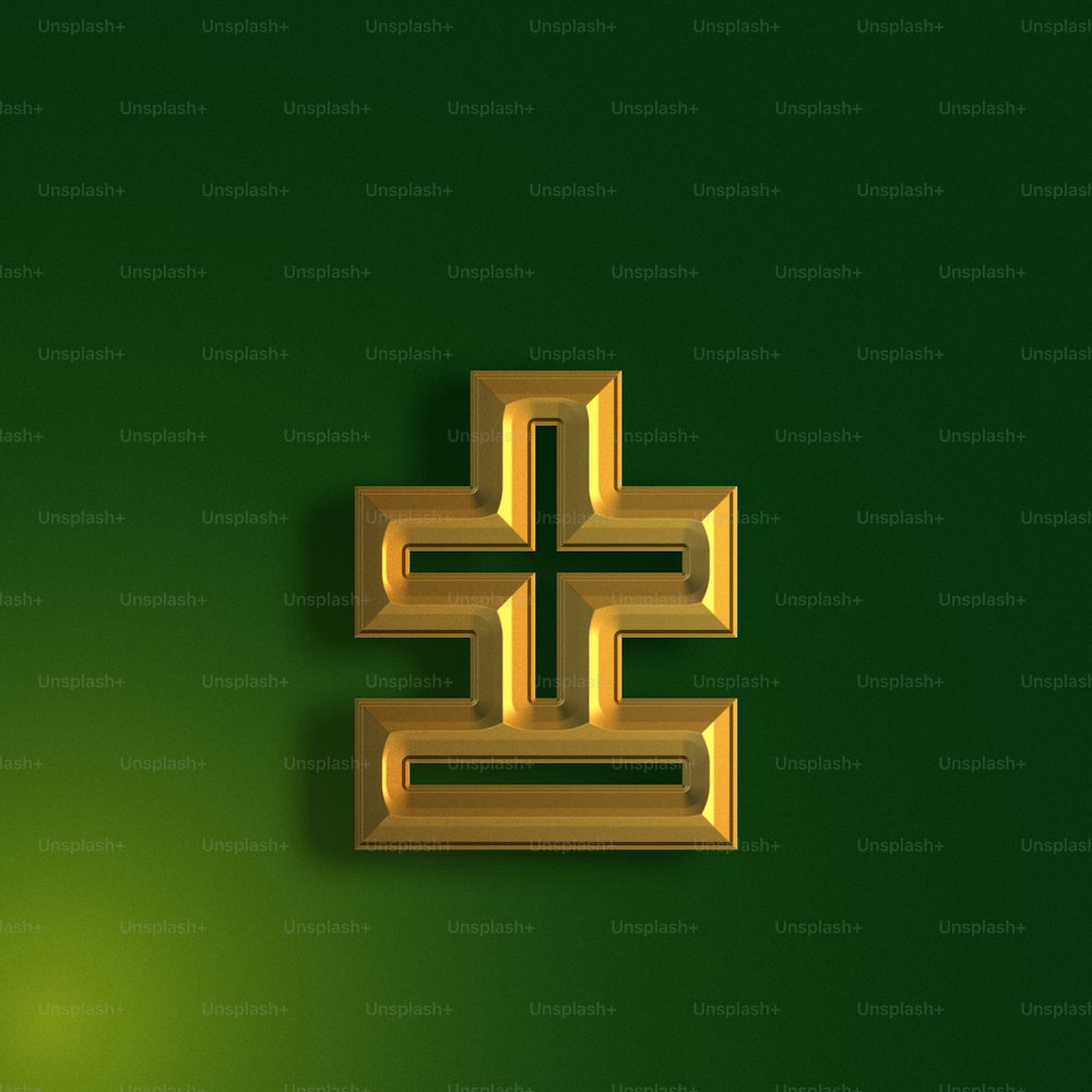 a green wall with a gold design on it