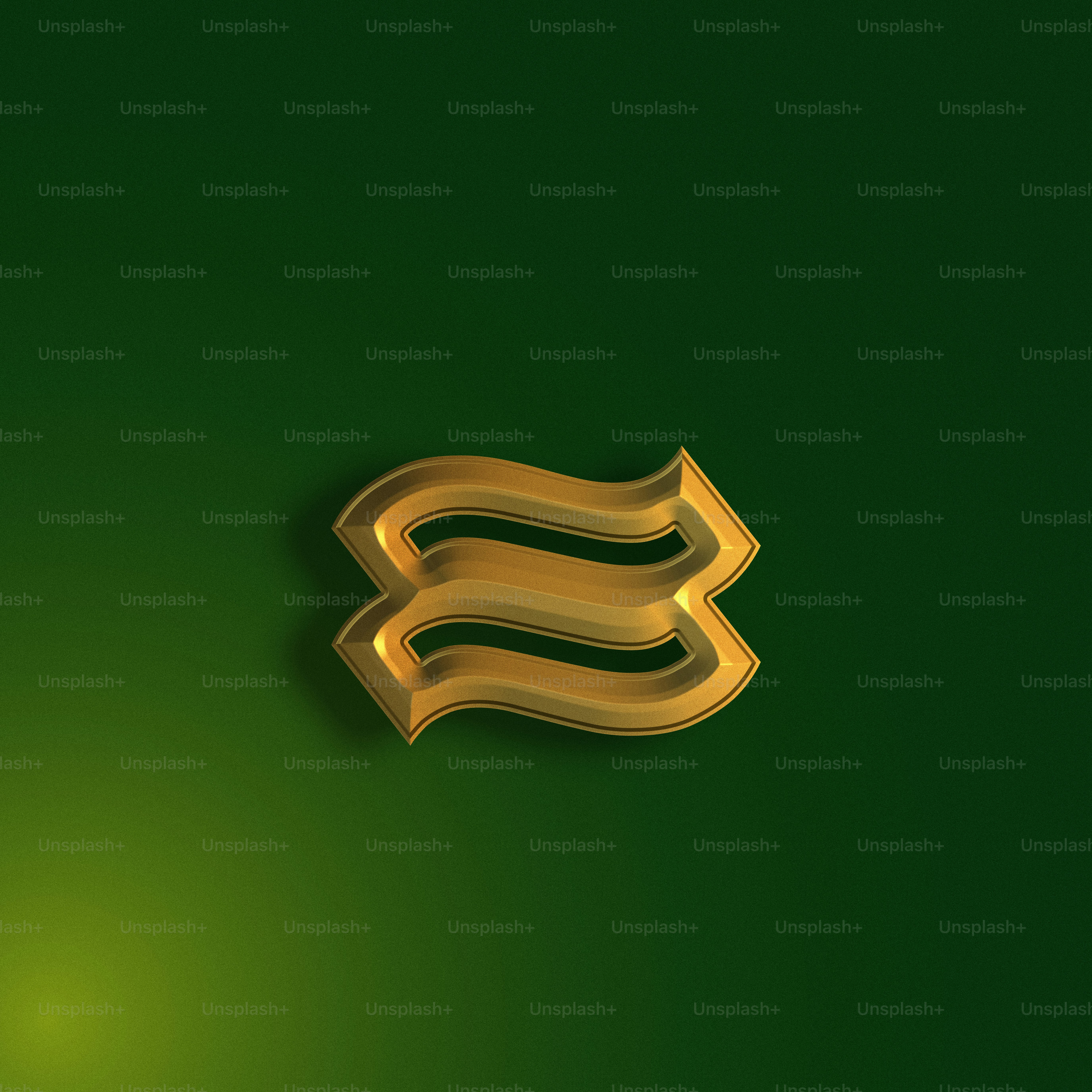 Una letra dorada brillante sobre un fondo verde