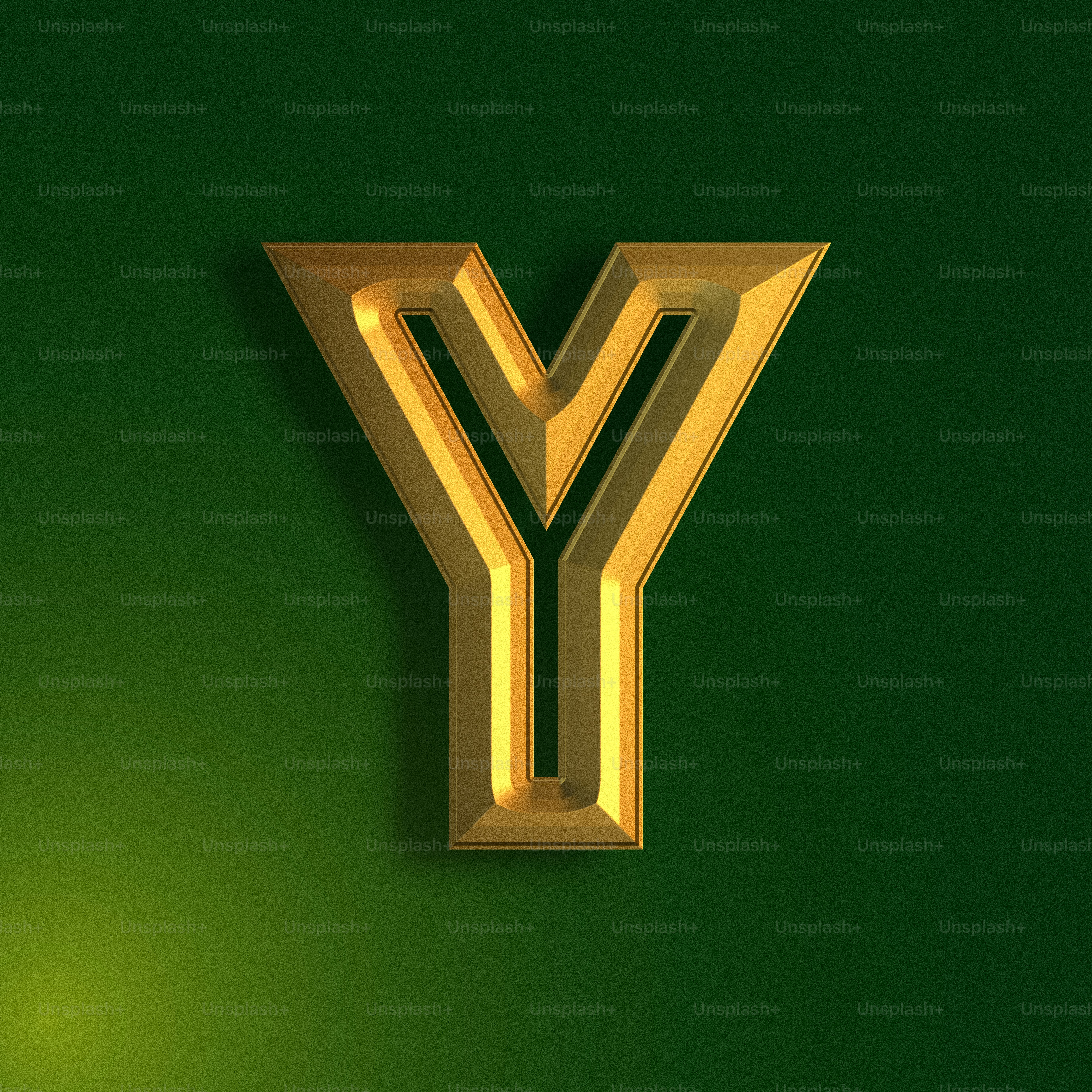 a gold letter y on a green background