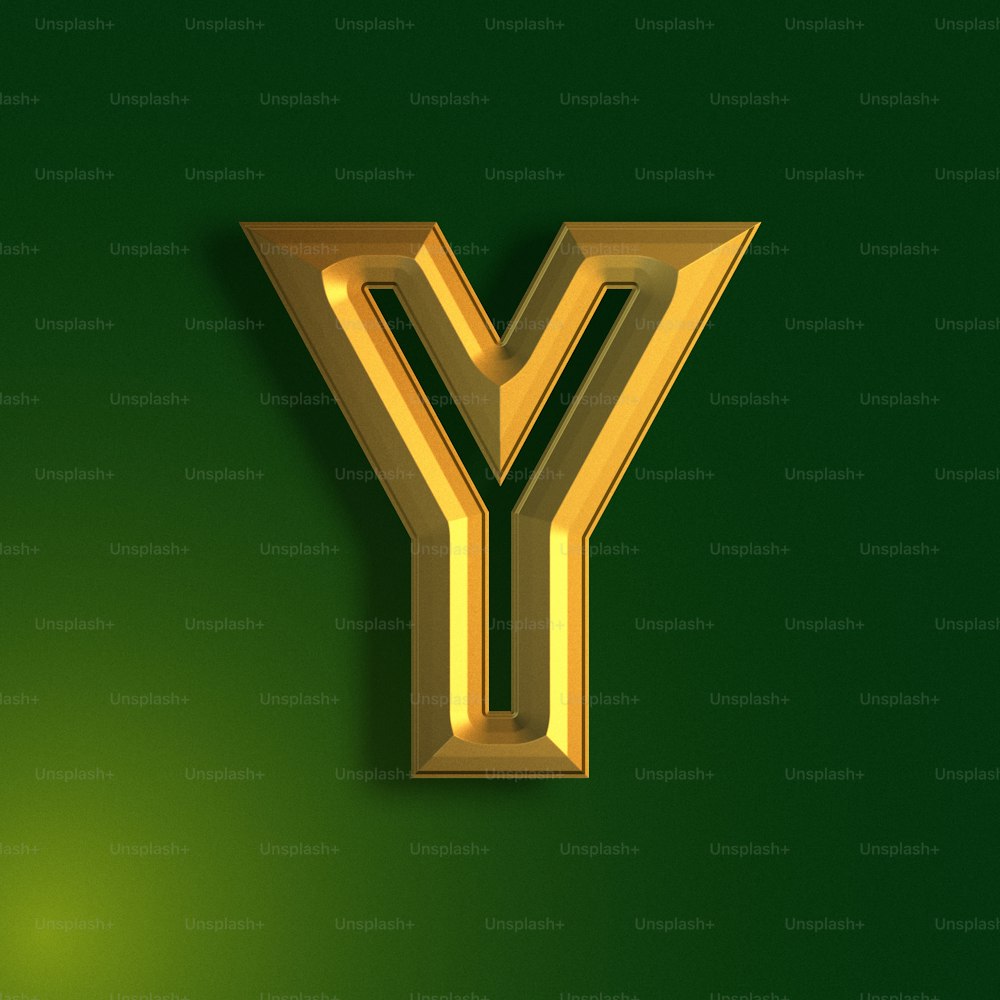a gold letter y on a green background