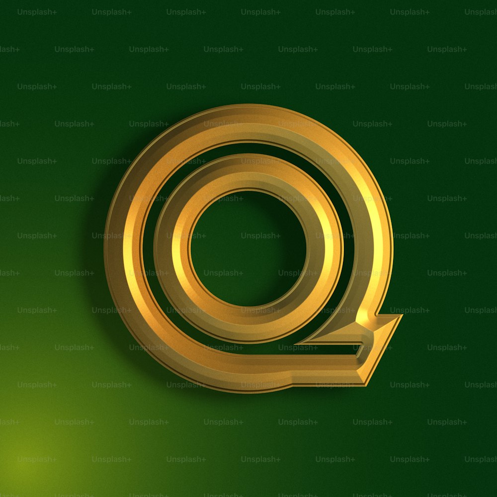 a golden q on a green background