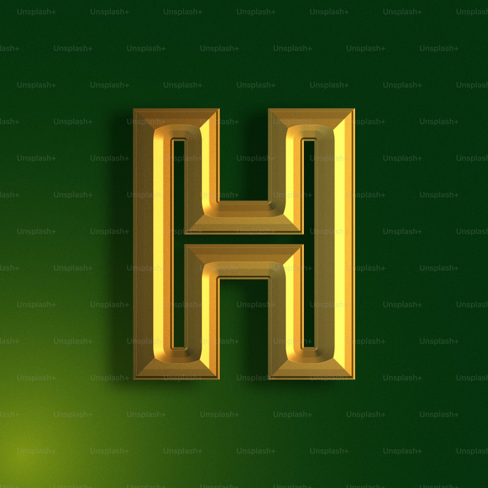a gold letter h on a green background