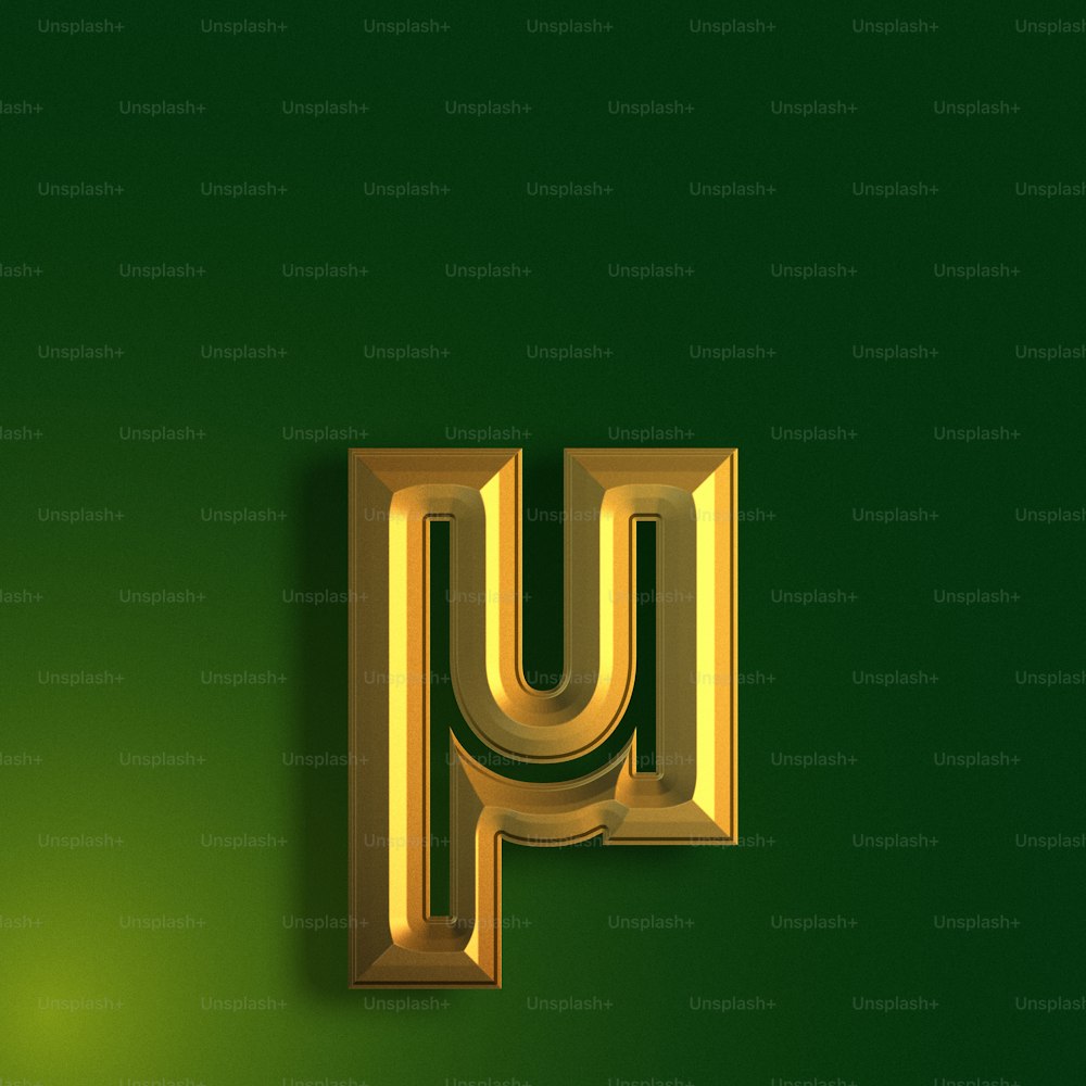 a gold letter that is on a green wall