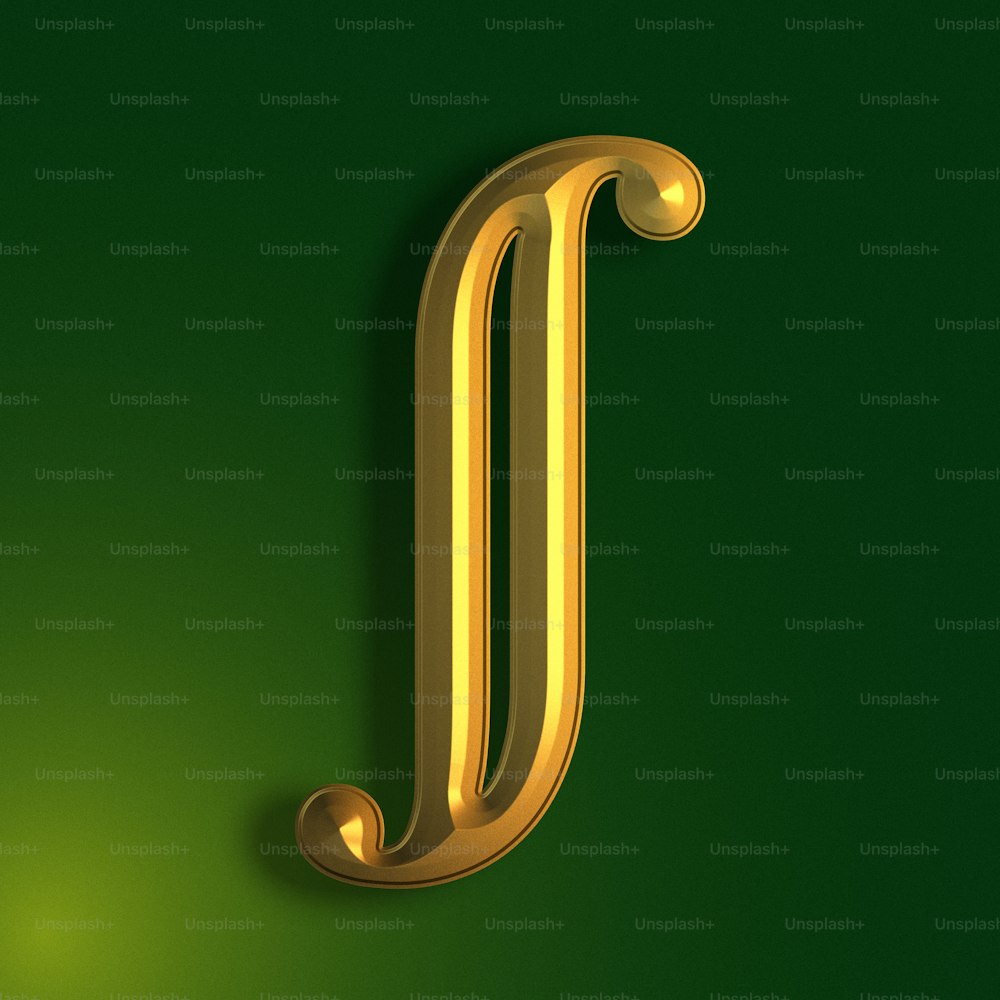 a gold letter j on a green background