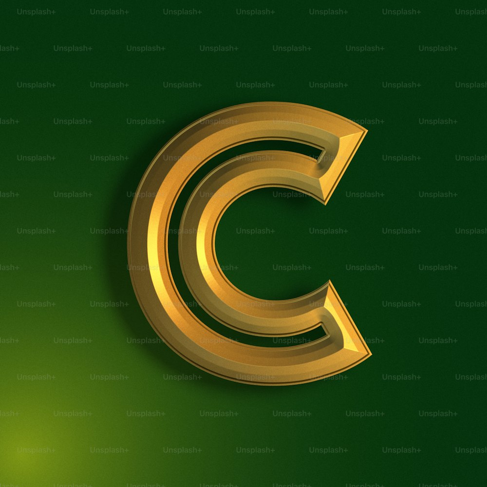 a golden letter c on a green background