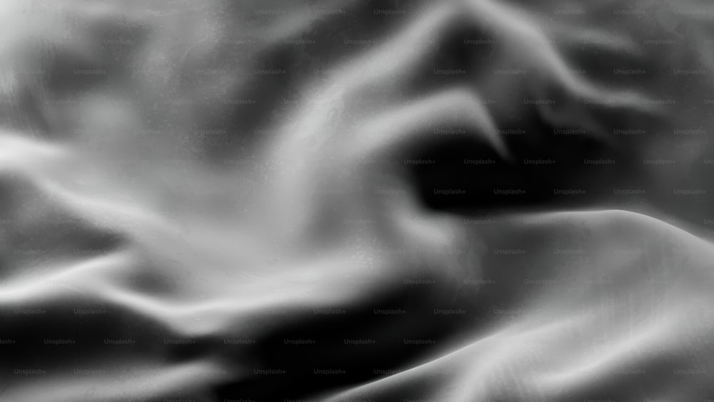 Une photo en noir et blanc d’un tissu ondulé