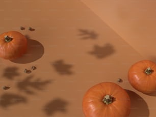a group of three tomatoes sitting on top of a table