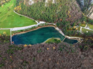 an aerial view of a lake surrounded by trees