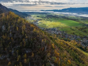 an aerial view of a town nestled on a mountain