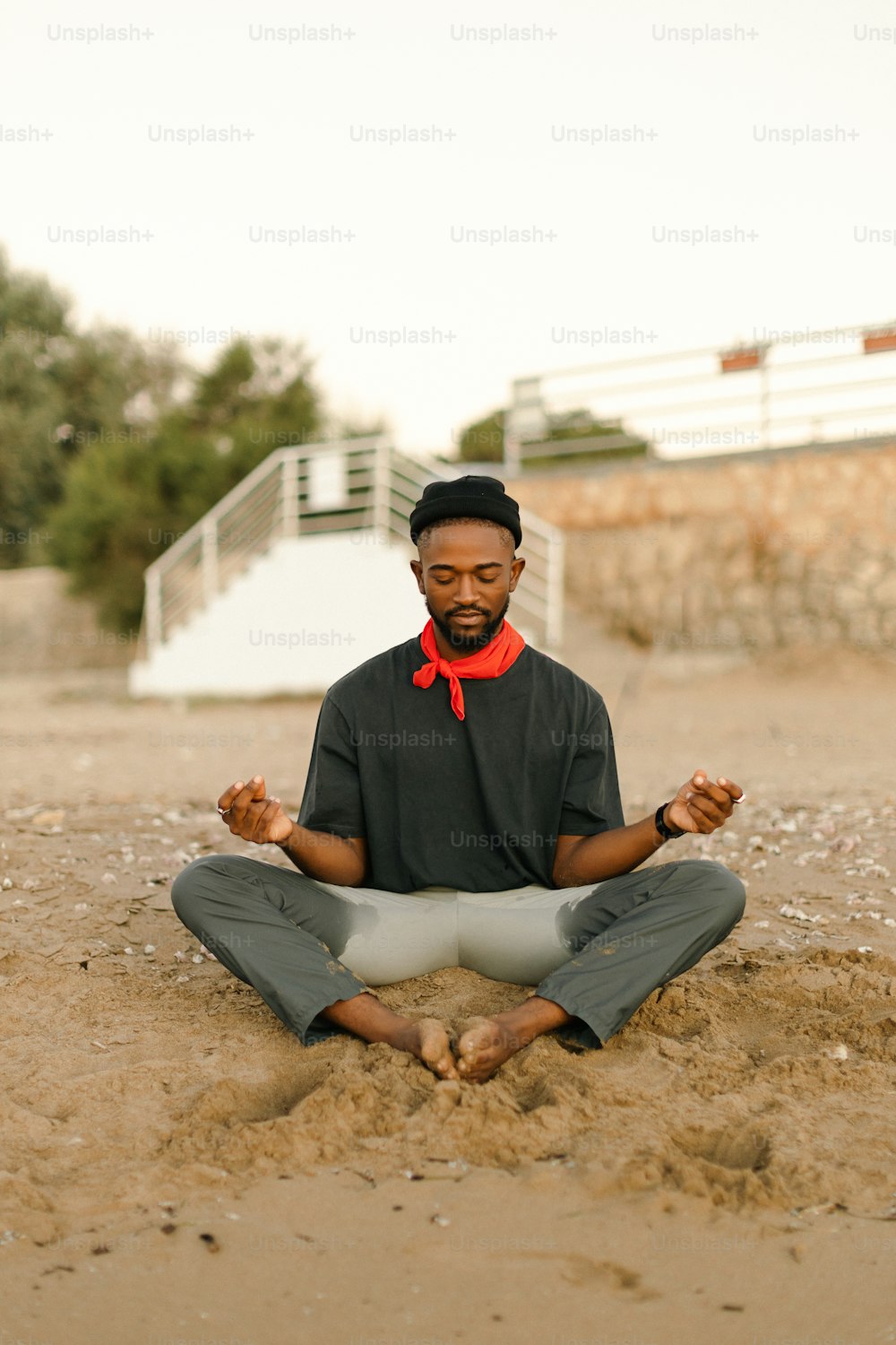 a man sitting in a lotus position on the ground