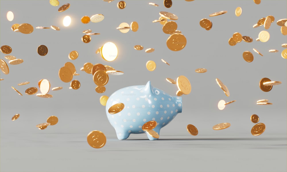 a blue piggy bank surrounded by gold coins