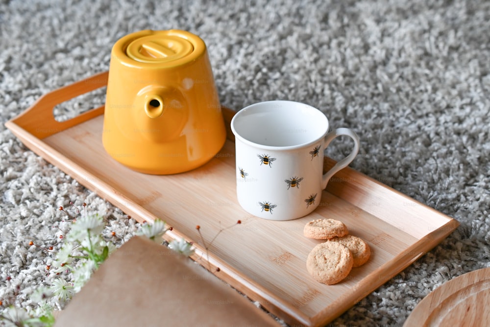 a tray with a mug and cookies on it