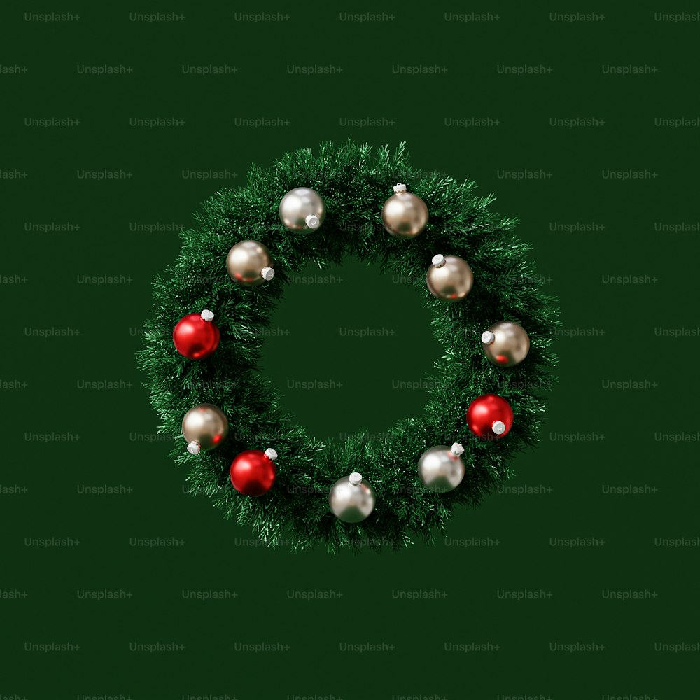 a green christmas wreath with red and white ornaments