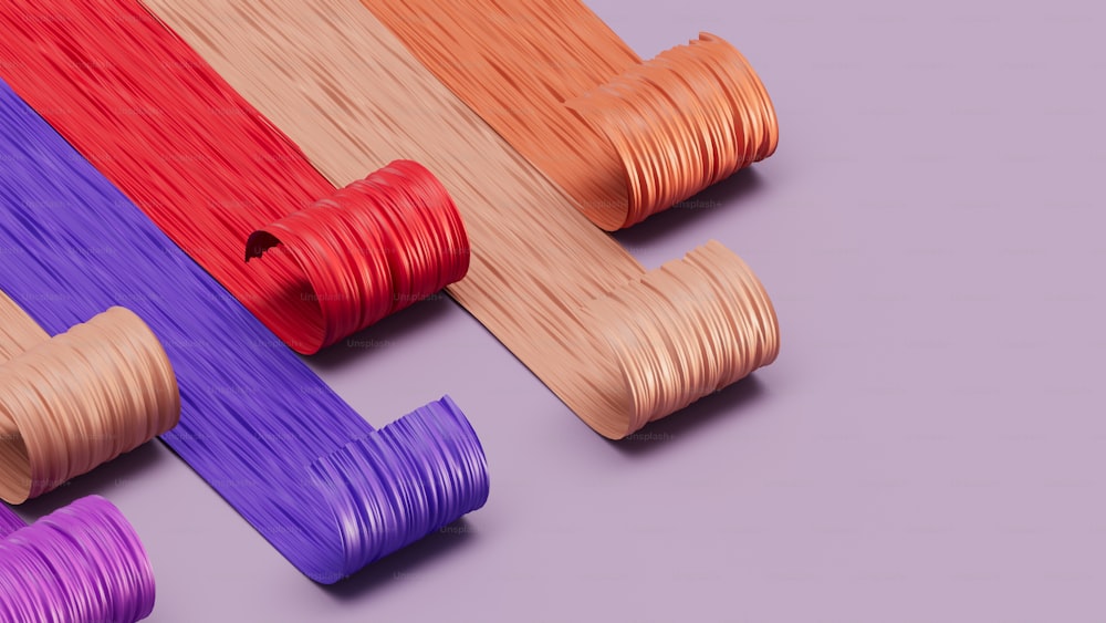 um grupo de cordas coloridas diferentes em um fundo roxo