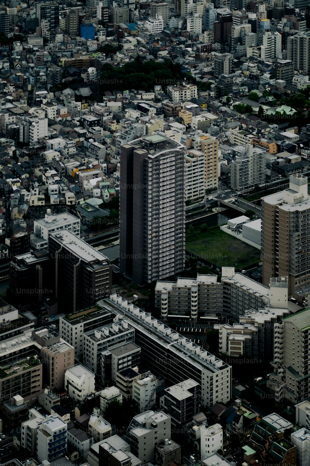 an aerial view of a city with tall buildings