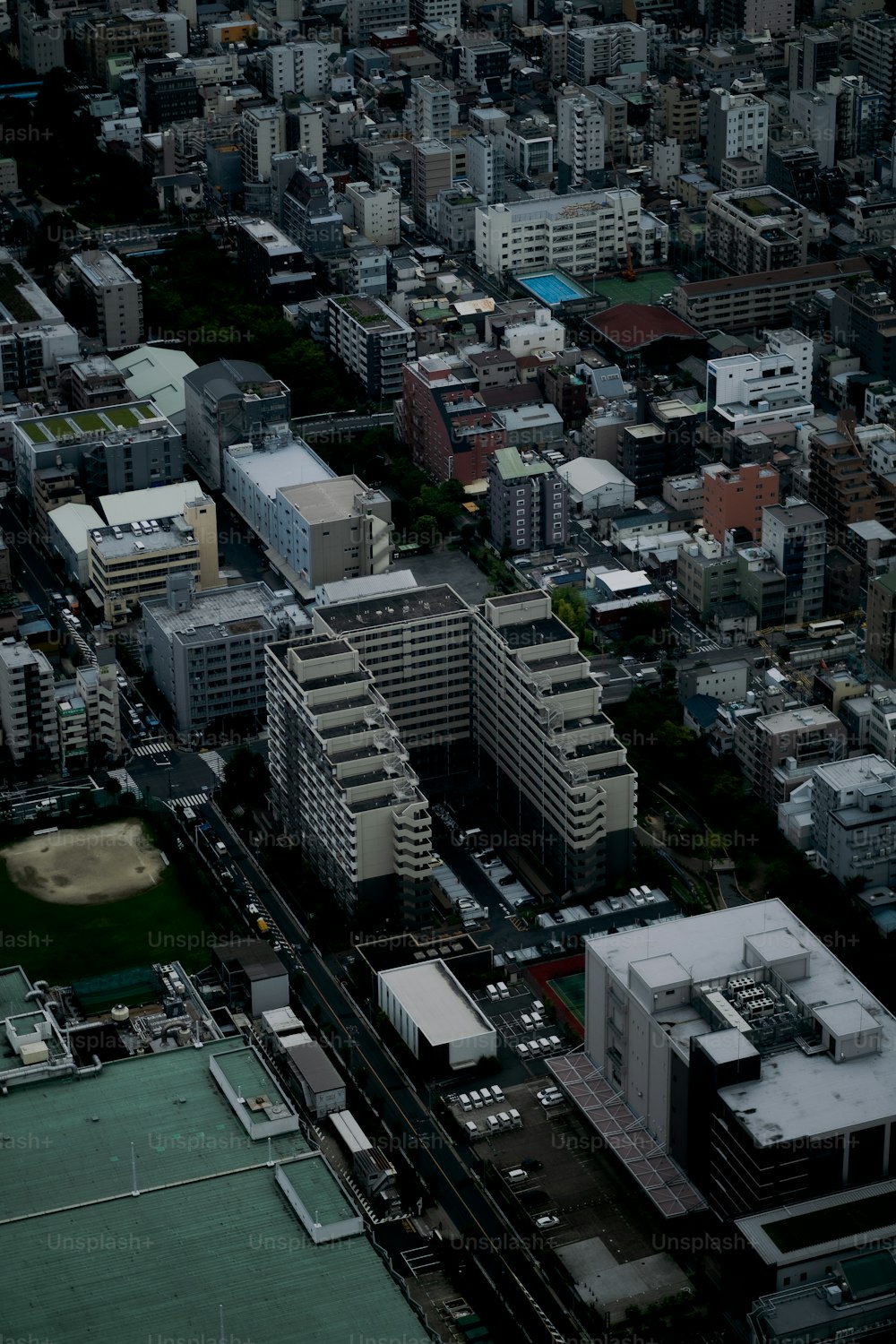 an aerial view of a city with tall buildings