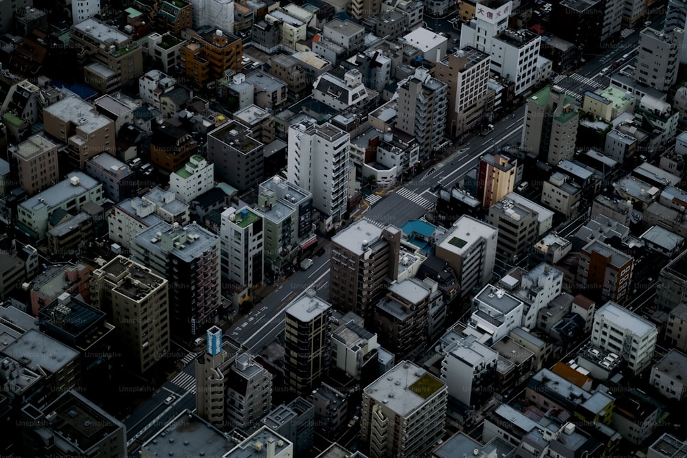 an aerial view of a city with tall buildings