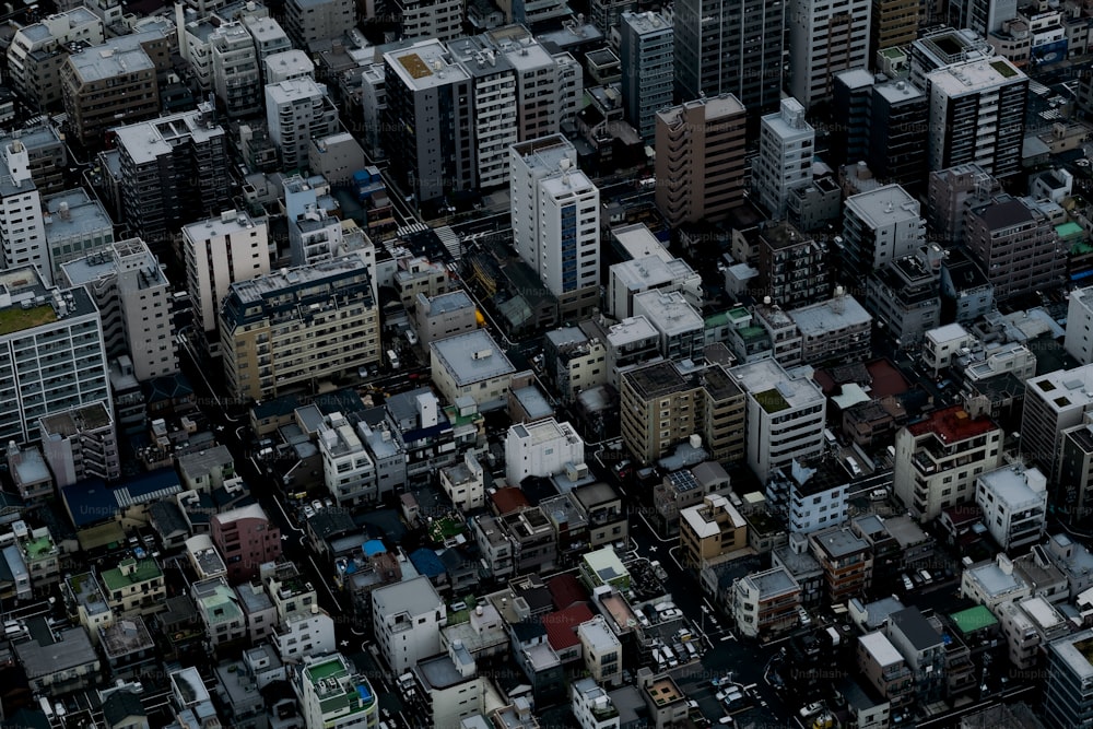 an aerial view of a city with tall buildings