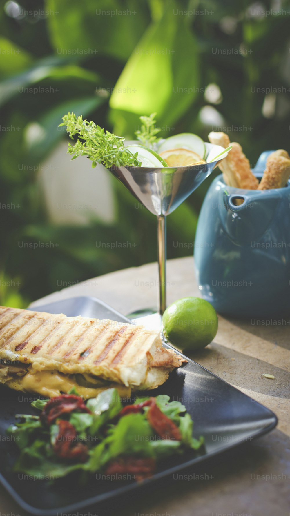 a plate of food and a drink on a table