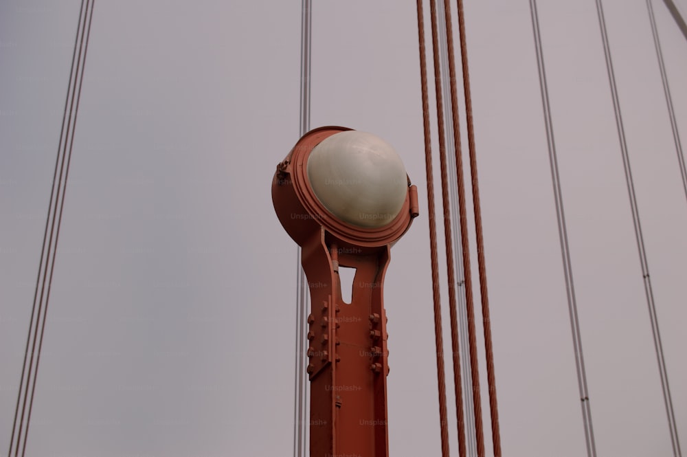 a close up of a street light on a pole