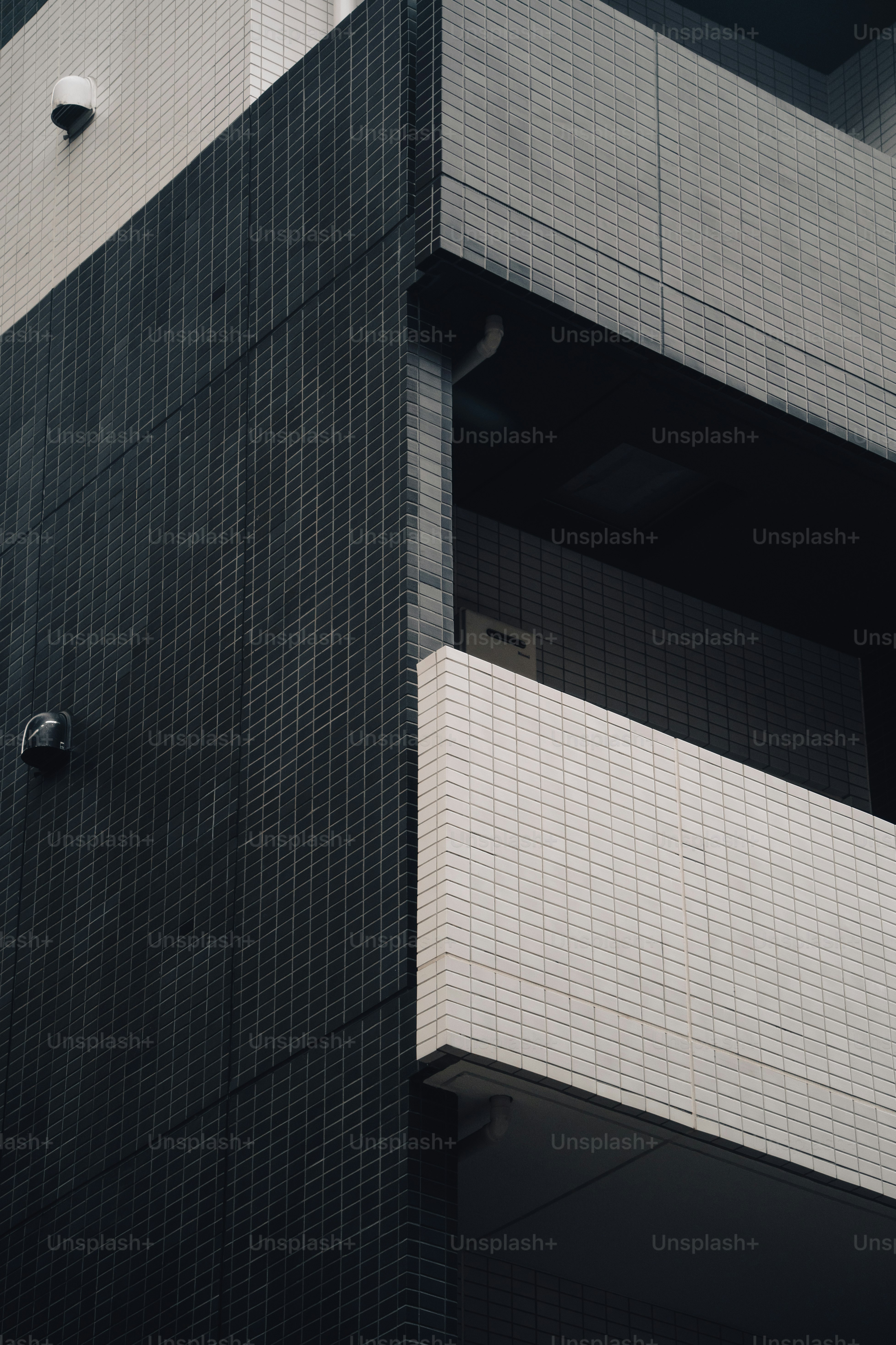 a clock on the side of a tall building